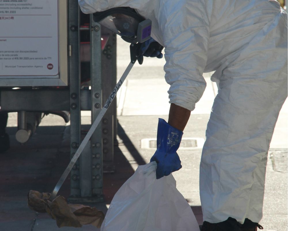 Specialist conducting a biohazard cleanup after an investigation in Knoxville, TN